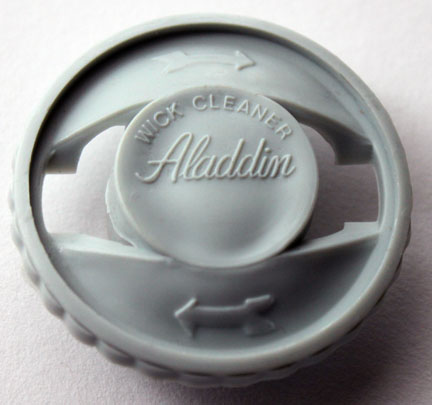 Early plastic Aladdin wick cleaner